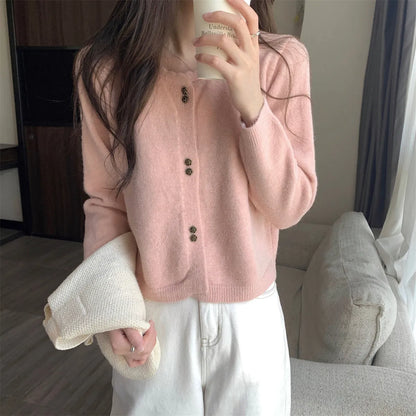 Women's milky white long sleeve acrylic cardigan sweater worn open, showing free size fit and regular sleeve design.
