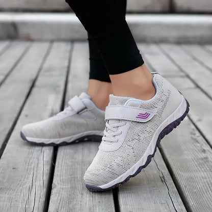 Women's gray purple casual shoes with mesh upper, wedge heel, and Velcro strap.