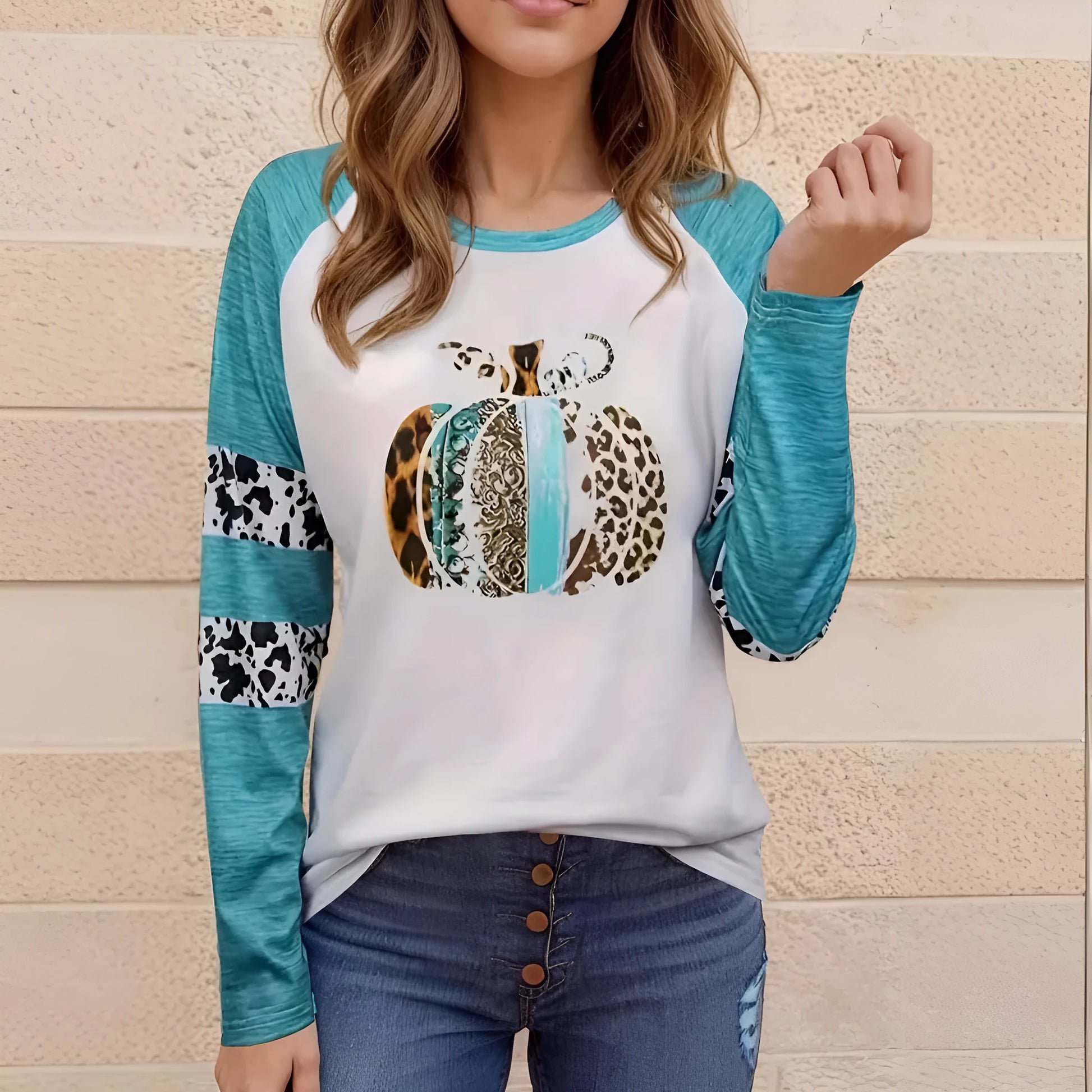 Sky blue long sleeve t-shirt with a large 3D printed Halloween pumpkin design on the front.