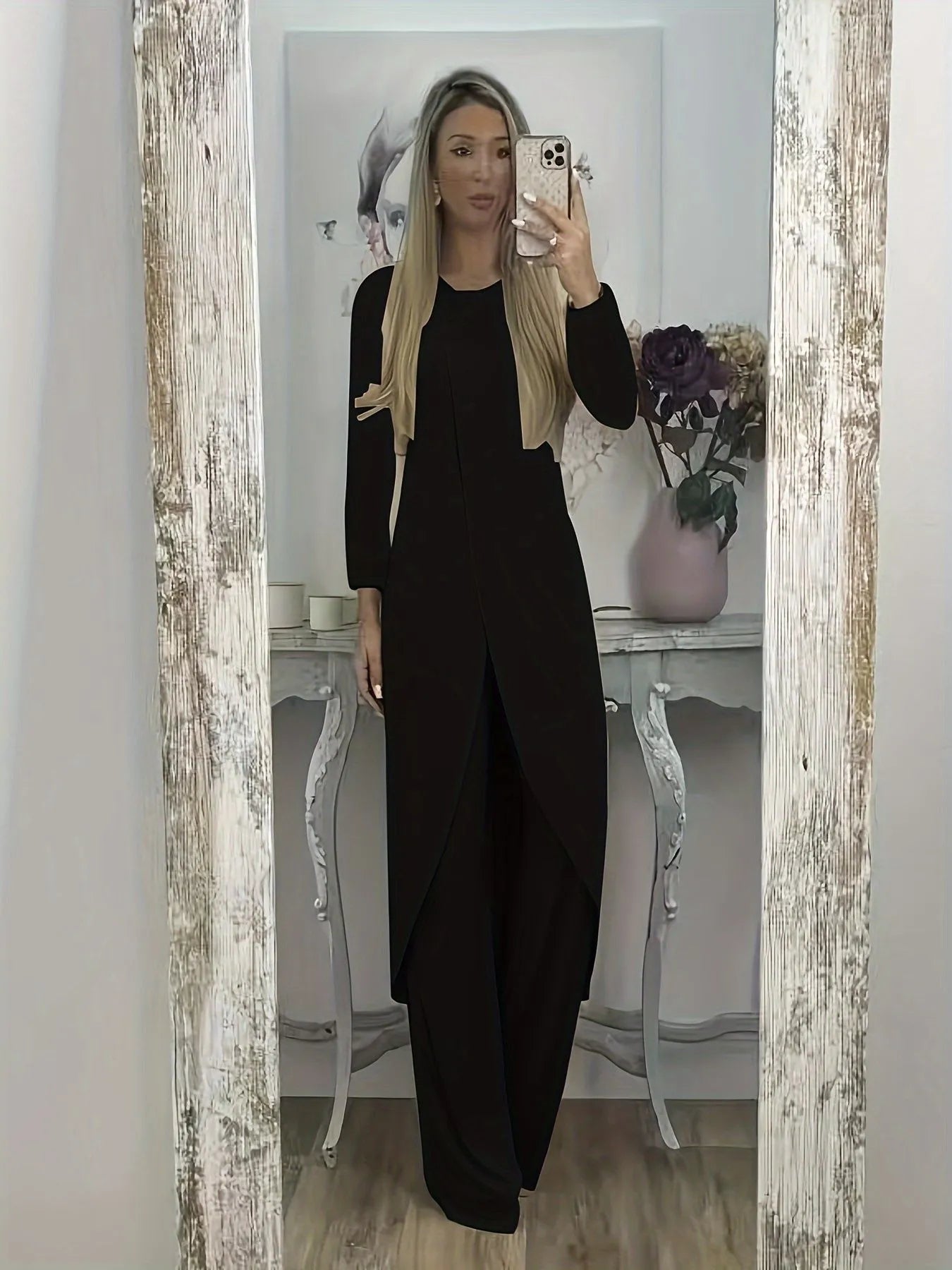 Black loose-fit polyester two-piece lounge set with long sleeves and matching trousers