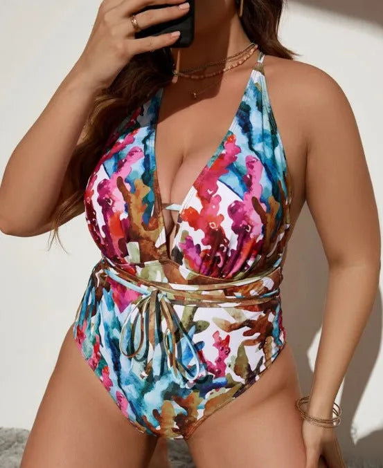 Purple halter neck one-piece swimsuit for women on a mannequin, showing brief style and back detail.