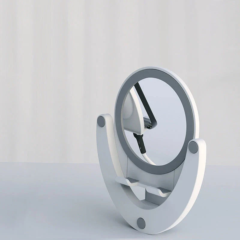 Adjustable phone stand with built-in makeup mirror for hands-free viewing and on-the-go grooming