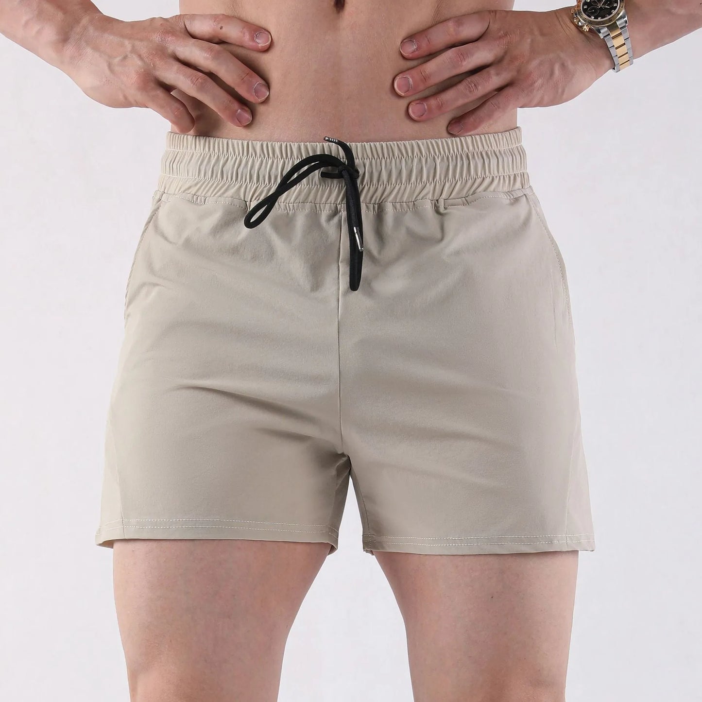 Men's thin grey polyester basketball shorts with an elastic waistband, shown laid flat.