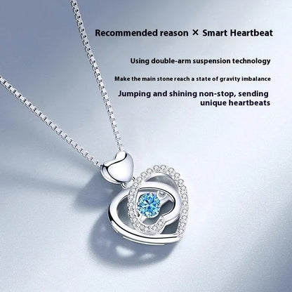 Blue diamond heart-shaped pendant necklace and matching bracelet set on a copper chain.
