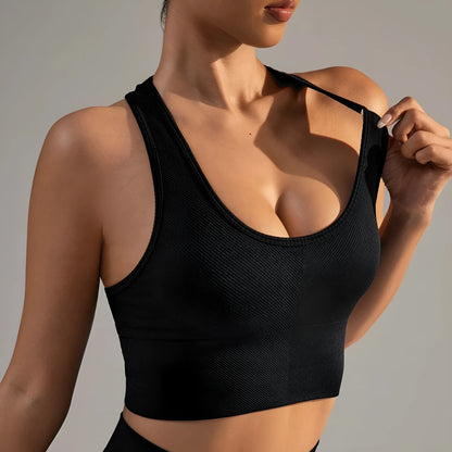 Black women's sports bra with fixed double shoulder straps and a full cup design on a mannequin.