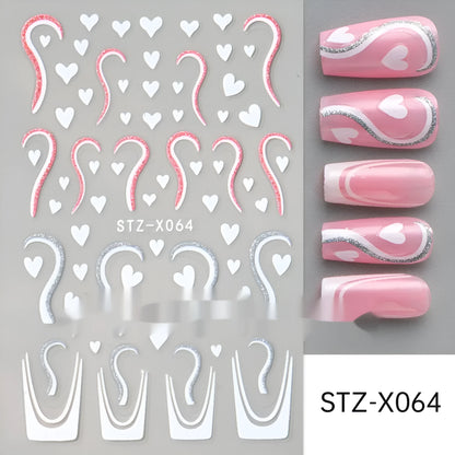 Assortment of black and silver nail sticker designs including cartoon and French tip patterns on a plastic sheet.
