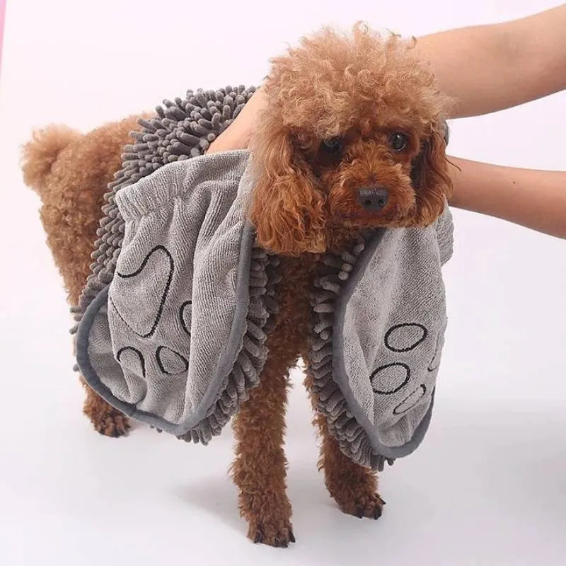 Blue dog bath robe towel laid flat, showing its 62cm by 23cm size and soft texture.