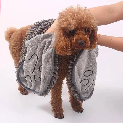Blue dog bath robe towel laid flat, showing its 62cm by 23cm size and soft texture.