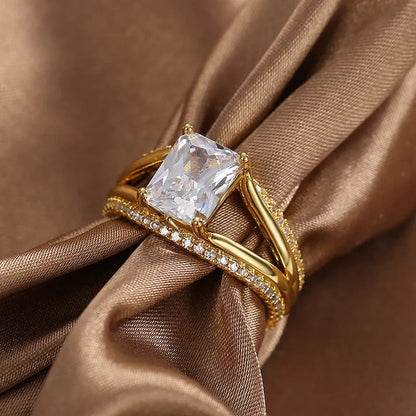 Women's gold-coloured geometric ring with square zircon stone on copper with electroplated finish
