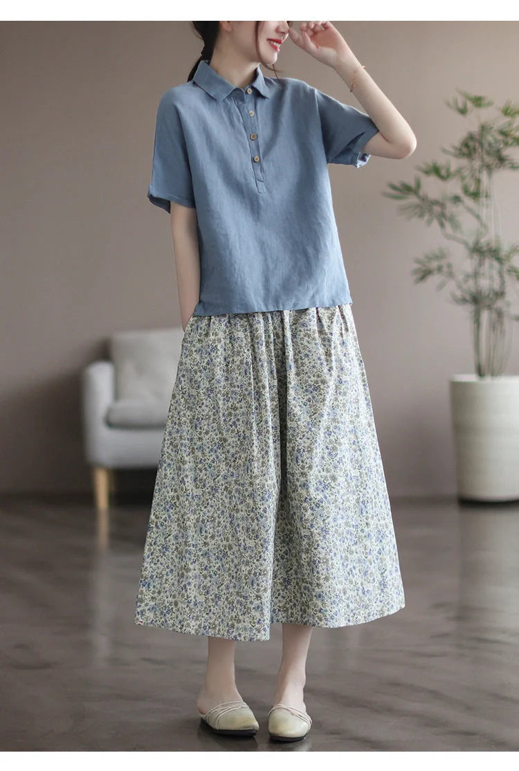 Elegant floral-printed cotton skirt with pleated design, available in yellow and blue flower patterns