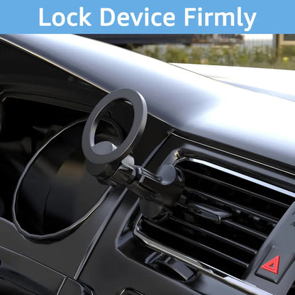 Black magnetic car phone holder with O-ring clip attached to a car air vent, holding a mobile phone securely.