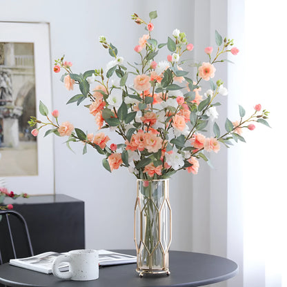 Artificial silk camellia flower in a vase, colours include white, pink, rose pink, and orange coffee.