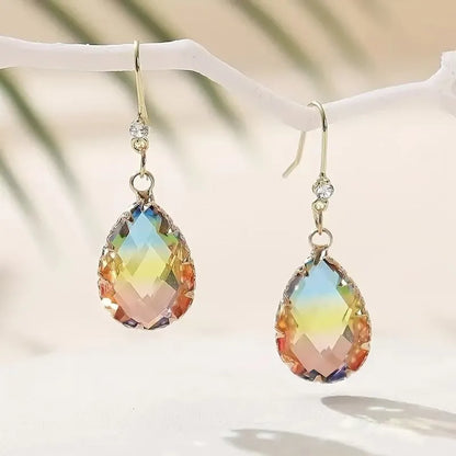 Coloured glass crystal heart-shaped earrings for women in blue, yellow, purple, and red styles.