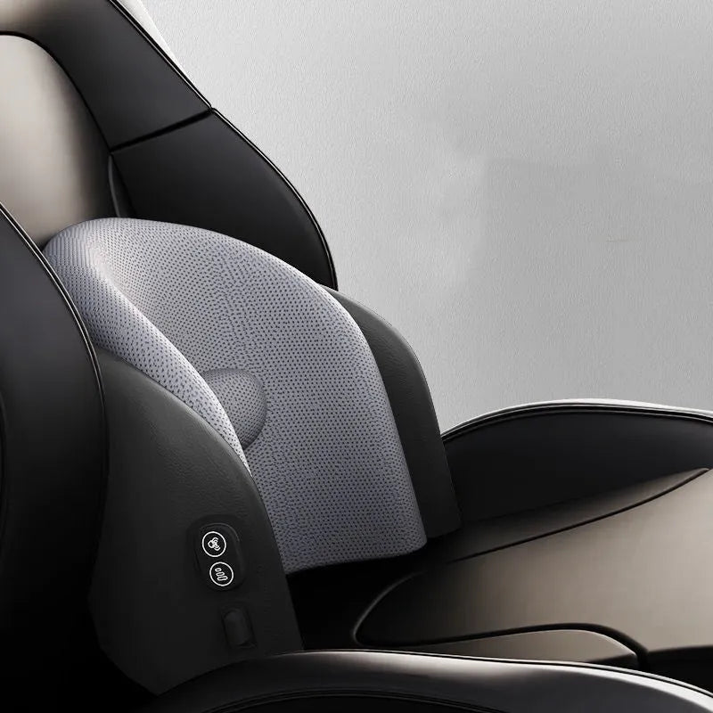 Black car massage cushion with headrest and lumbar support on a car seat, showing wired controller.