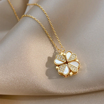 Exclusive four-leaf clover pendant necklace in stainless steel with crystal heart charm, a versatile jewellery piece for women
