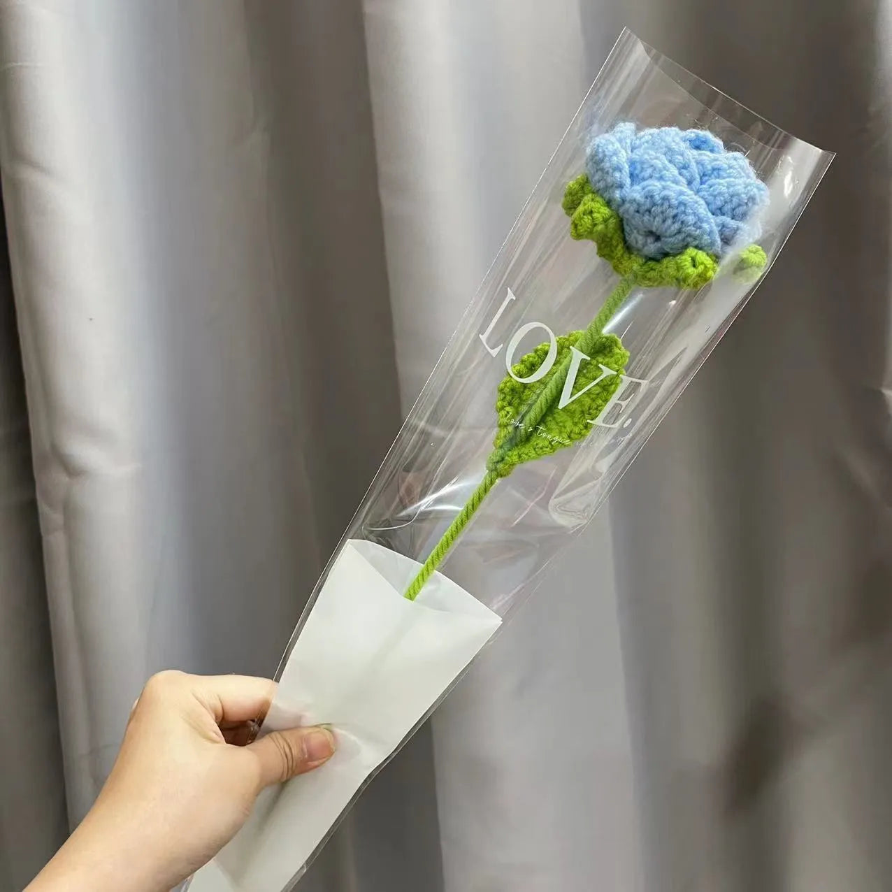 Wool-woven artificial silk rose bouquet in gradient blue colour with textured floral arrangement