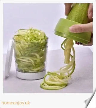 Adjustable spiral cutter with container for creating decorative vegetable and fruit spirals in the kitchen
