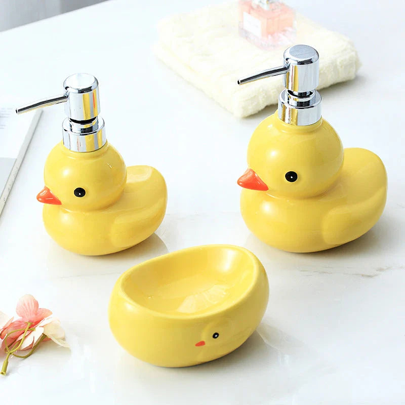 Adorable yellow ceramic soap dispenser with duck design and matching soap dish