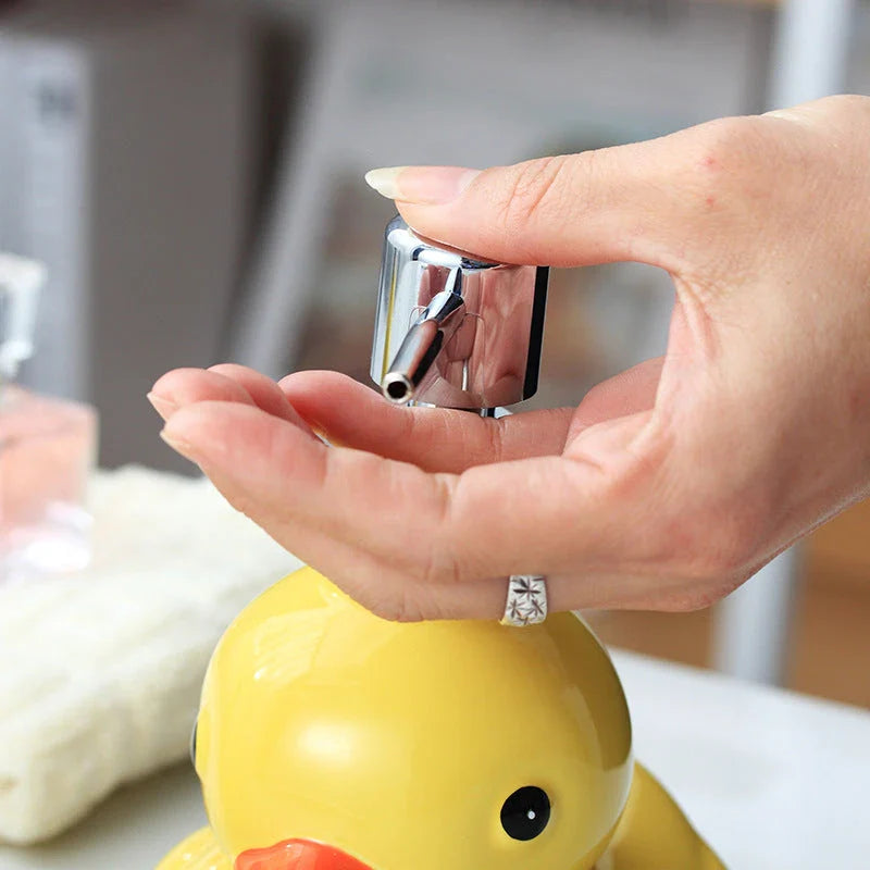 Adorable yellow ceramic soap dispenser with duck design and matching soap dish