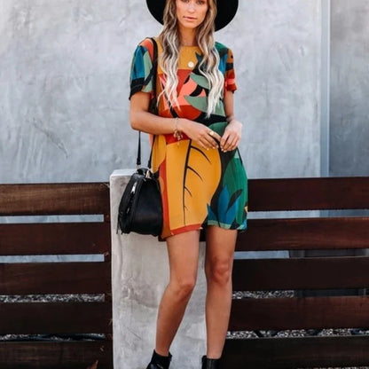 Stylish short-sleeved dress with a vibrant graffiti print and round neckline