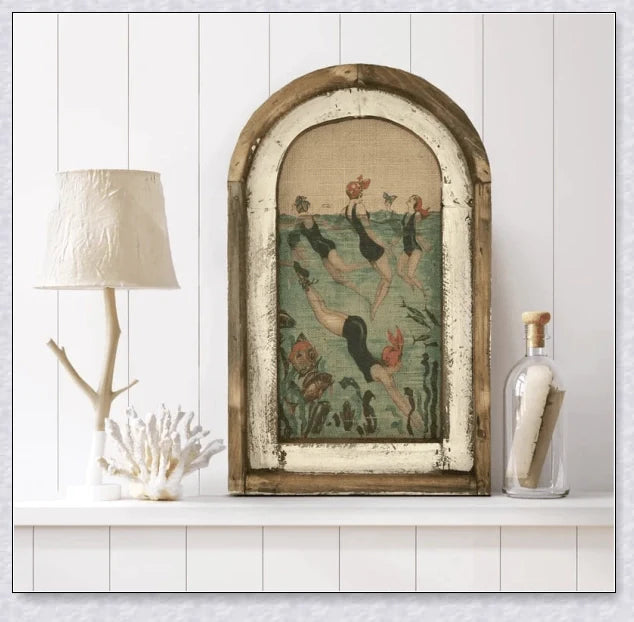 Decorative wall art featuring multiple swimmers and mermaids in a serene, aquatic-themed design