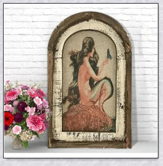 Decorative wall art featuring multiple swimmers and mermaids in a serene, aquatic-themed design