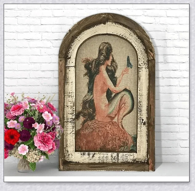 Decorative wall art featuring multiple swimmers and mermaids in a serene, aquatic-themed design