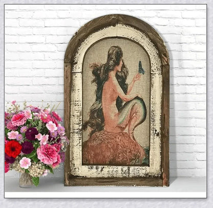 Decorative wall art featuring multiple swimmers and mermaids in a serene, aquatic-themed design
