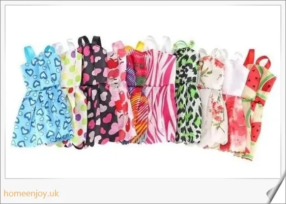 A diverse collection of 85 Barbie doll accessories including colourful dresses, shoes, bags, and jewellery.