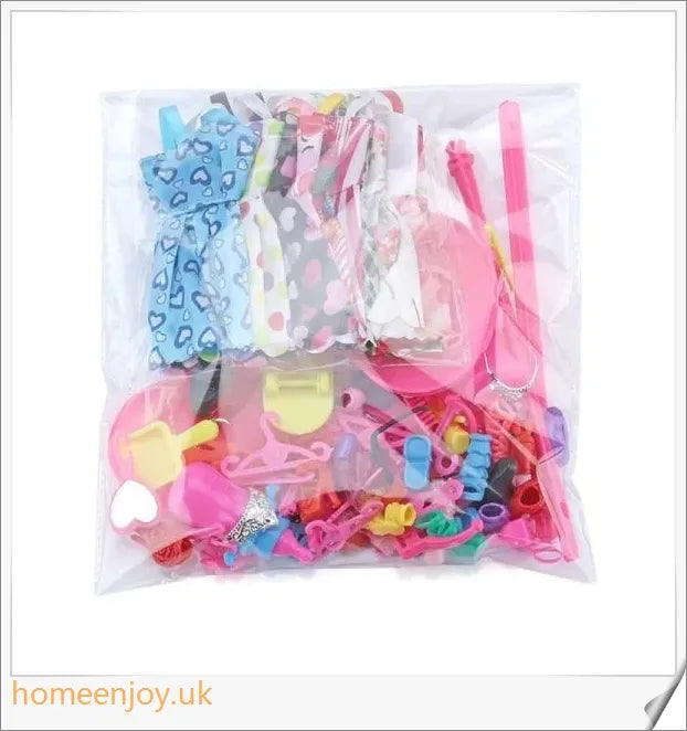 A diverse collection of 85 Barbie doll accessories including colourful dresses, shoes, bags, and jewellery.
