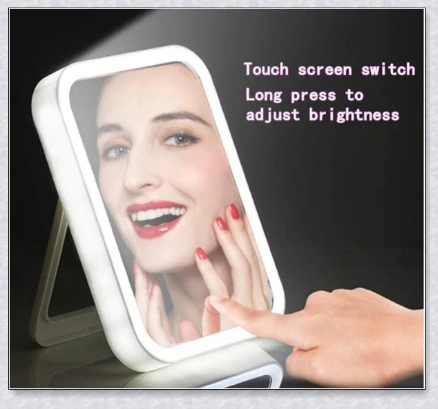 Traby Hand Smart Makeup Mirror with touch screen controls, adjustable brightness, and 45-degree rotation for easy on-the-go beauty touch-ups