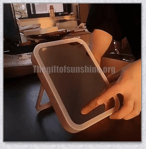 Traby Hand Smart Makeup Mirror with touch screen controls, adjustable brightness, and 45-degree rotation for easy on-the-go beauty touch-ups