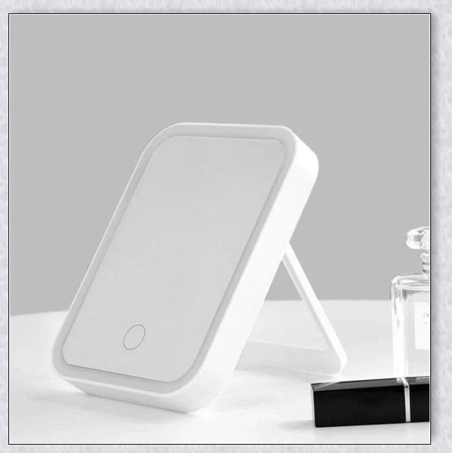 Traby Hand Smart Makeup Mirror with touch screen controls, adjustable brightness, and 45-degree rotation for easy on-the-go beauty touch-ups