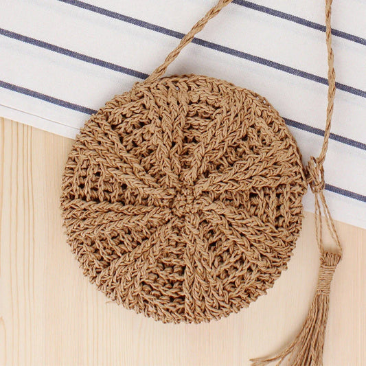 Bohemian rattan round crossbody bag in beige colour with tassel accent