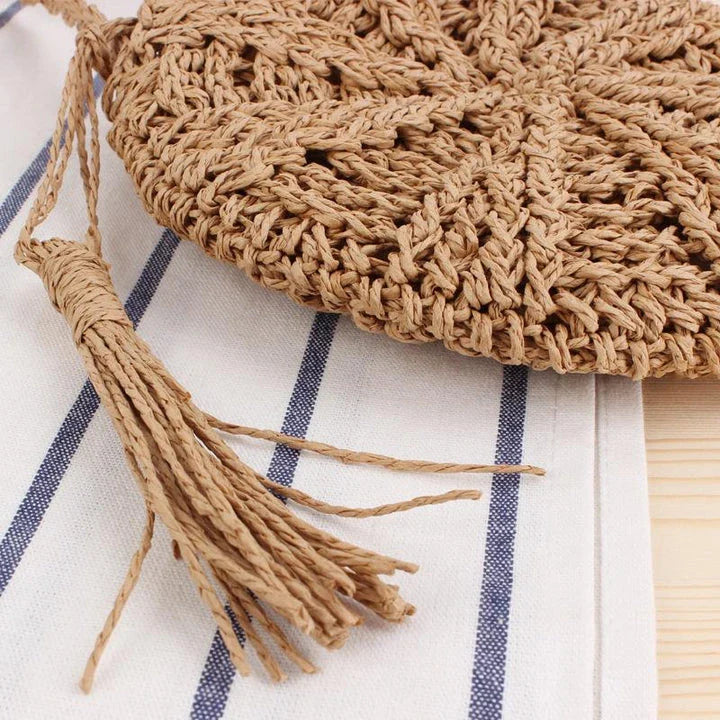 Bohemian rattan round crossbody bag in beige colour with tassel accent