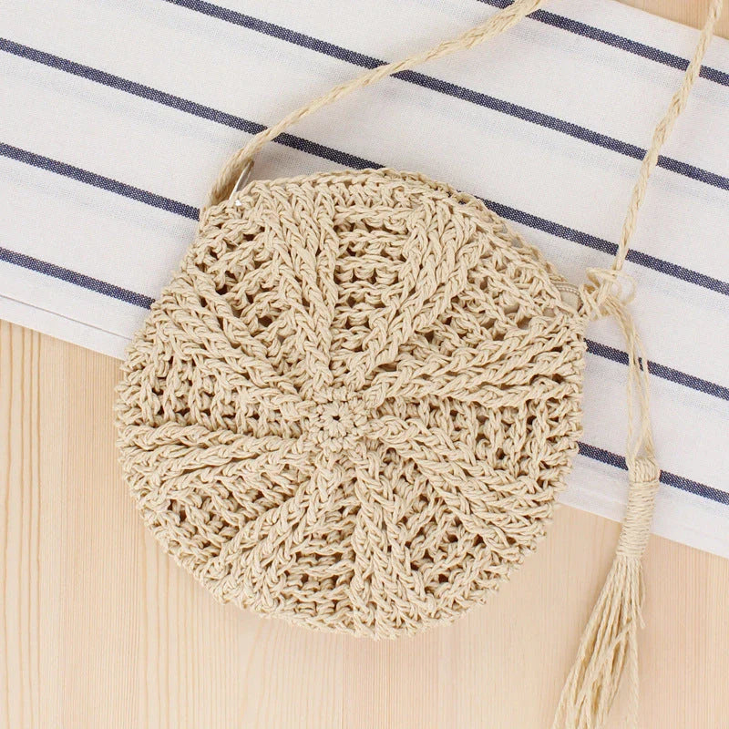 Bohemian rattan round crossbody bag in beige colour with tassel accent