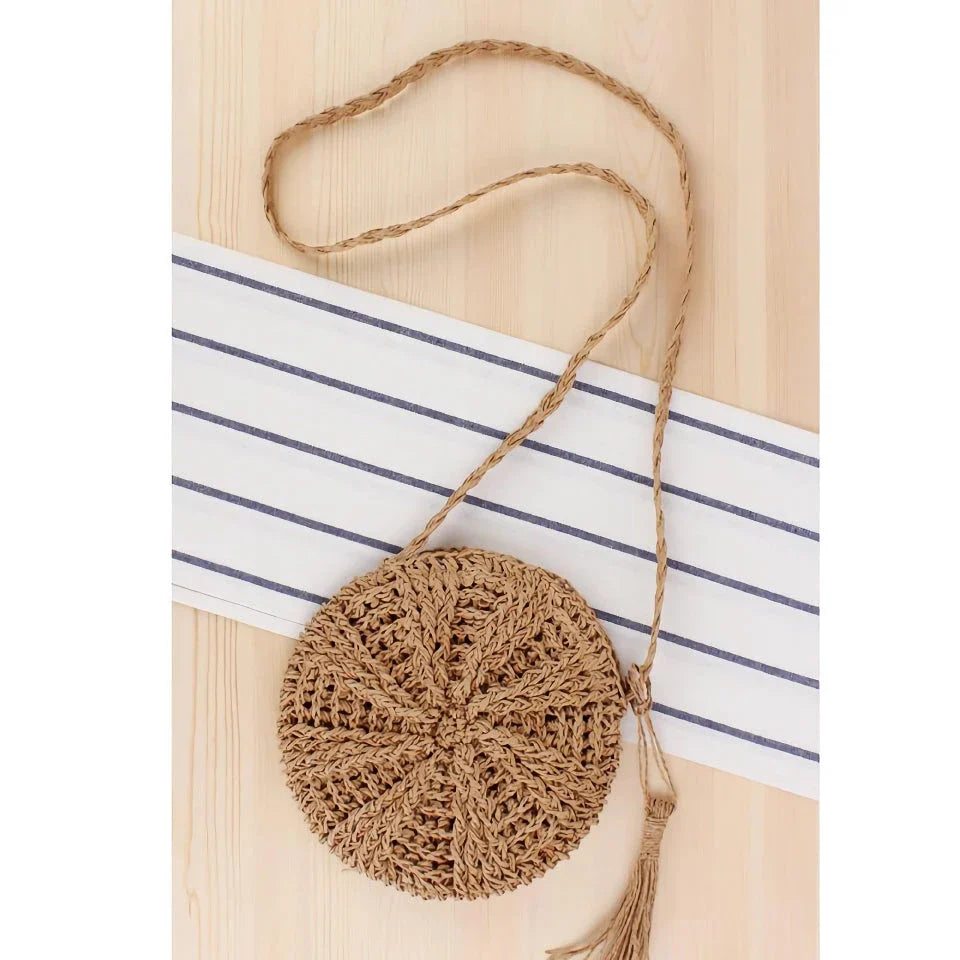 Bohemian rattan round crossbody bag in beige colour with tassel accent
