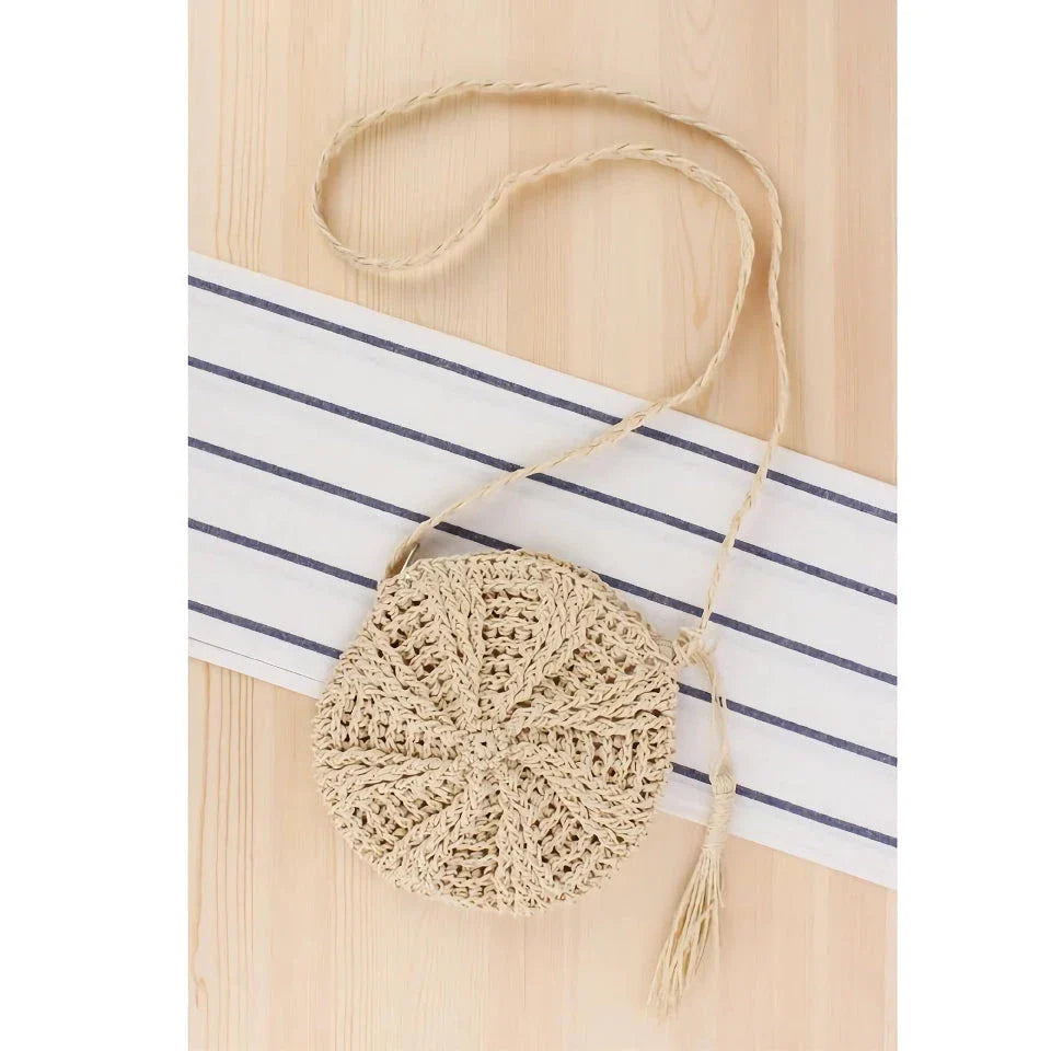 Bohemian rattan round crossbody bag in beige colour with tassel accent