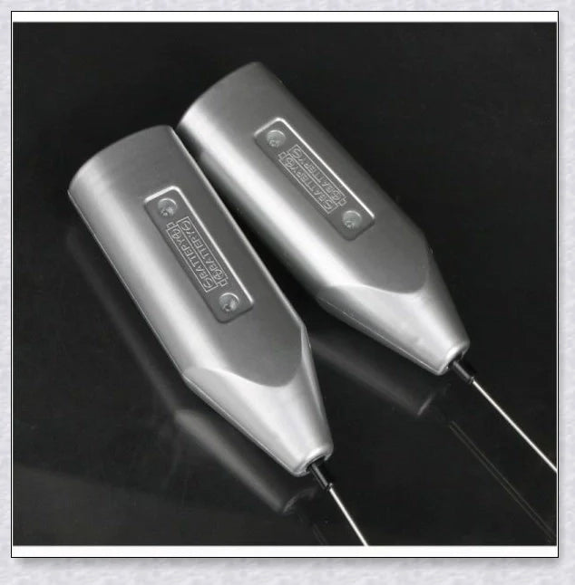 A compact, stainless steel milk frother with a modern, minimalist design, perfect for creating rich, velvety milk foam for coffee and tea drinks.