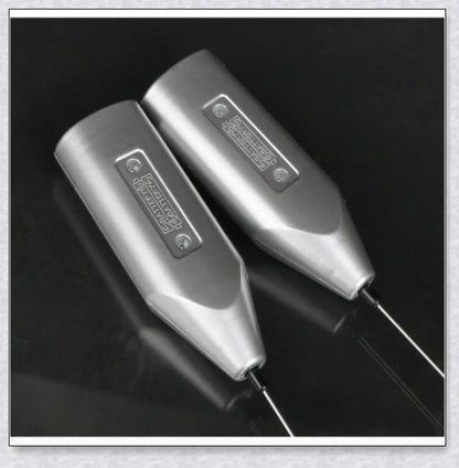 A compact, stainless steel milk frother with a modern, minimalist design, perfect for creating rich, velvety milk foam for coffee and tea drinks.