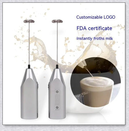 A compact, stainless steel milk frother with a modern, minimalist design, perfect for creating rich, velvety milk foam for coffee and tea drinks.