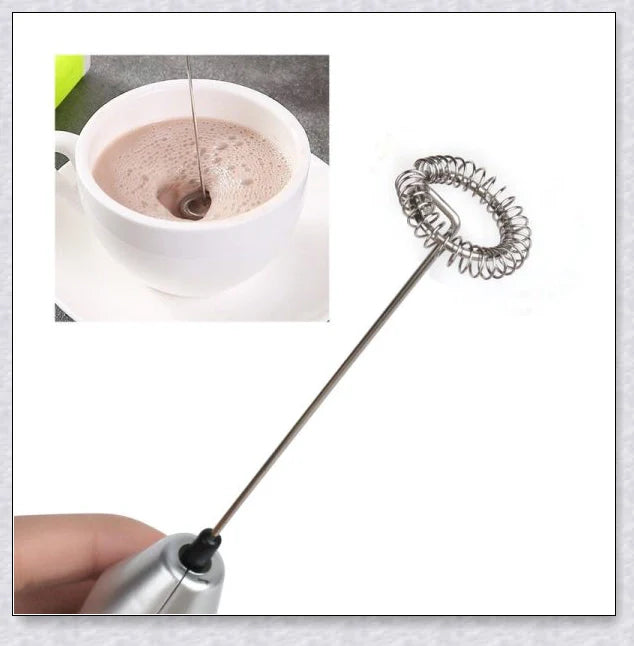A compact, stainless steel milk frother with a modern, minimalist design, perfect for creating rich, velvety milk foam for coffee and tea drinks.