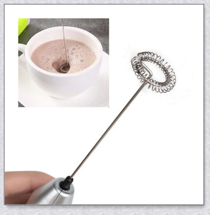 A compact, stainless steel milk frother with a modern, minimalist design, perfect for creating rich, velvety milk foam for coffee and tea drinks.
