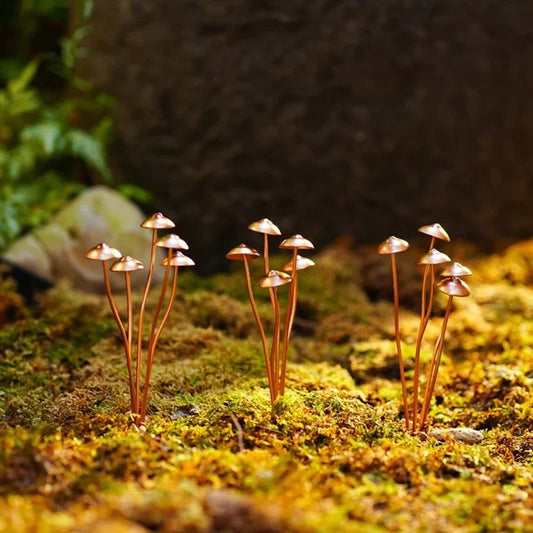 Creative Metal Simulation Mushroom Courtyard Decoration, featuring lifelike metal mushrooms in a natural, whimsical setting