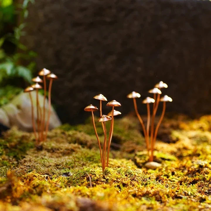 Creative Metal Simulation Mushroom Courtyard Decoration, featuring lifelike metal mushrooms in a natural, whimsical setting