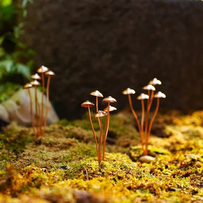 Creative Metal Simulation Mushroom Courtyard Decoration, featuring lifelike metal mushrooms in a natural, whimsical setting