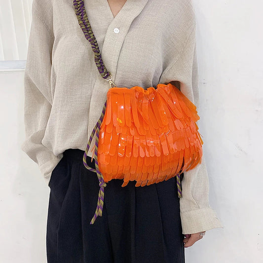 A stylish, jelly-like shoulder messenger bag in a vibrant green colour, featuring a sleek horizontal square shape and a convenient withdraw opening.