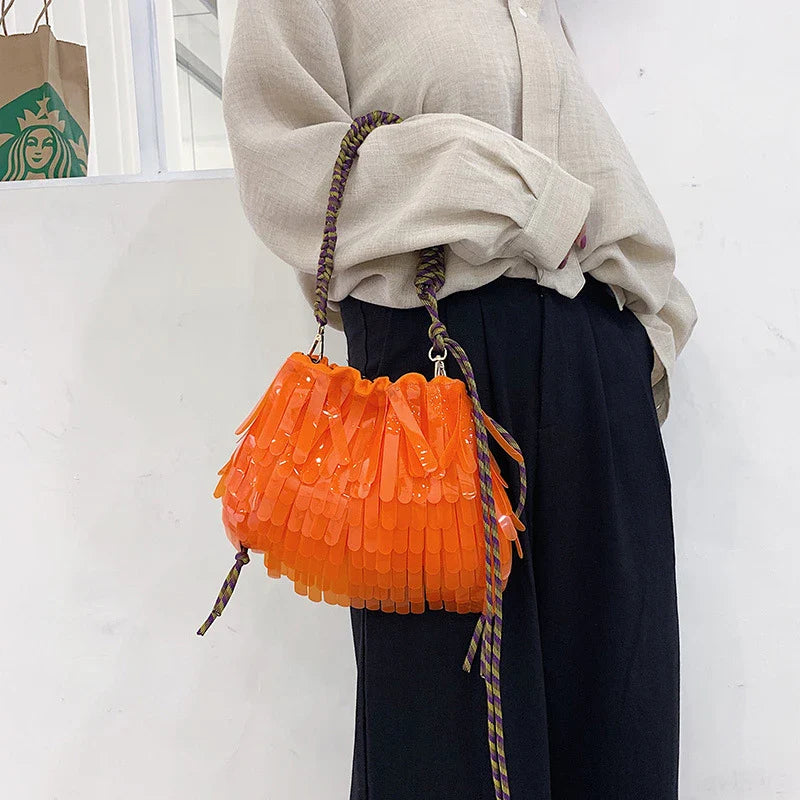 A stylish, jelly-like shoulder messenger bag in a vibrant green colour, featuring a sleek horizontal square shape and a convenient withdraw opening.