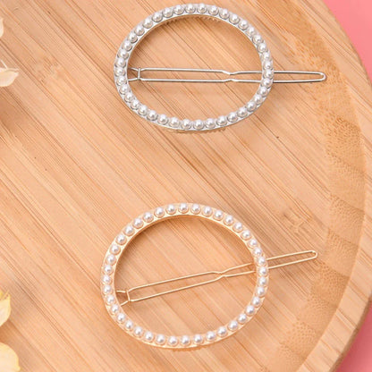 Elegant pearl and geometric hairpins in silver round design, perfect for adding sophistication to hairstyles