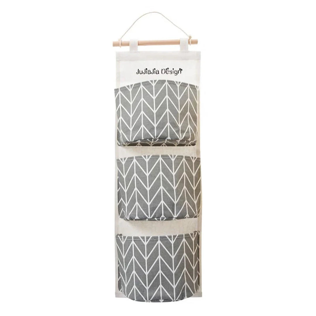 Hanging Storage Bag made from durable linen cloth with waterproof coating, featuring three spacious pockets for convenient organisation